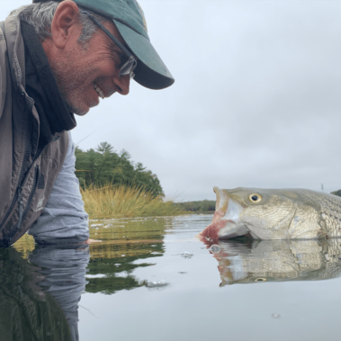Dan with a fish in the water