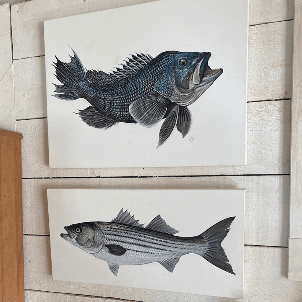 2 fish paintings on the wall in Dan's studio